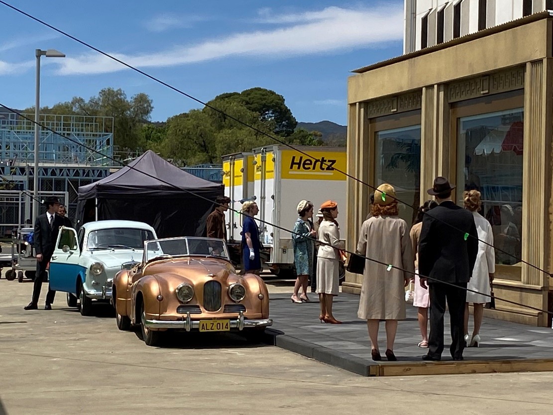 Noddy on the set of Ladies in Black resplendant in NSW number plates circa 1960